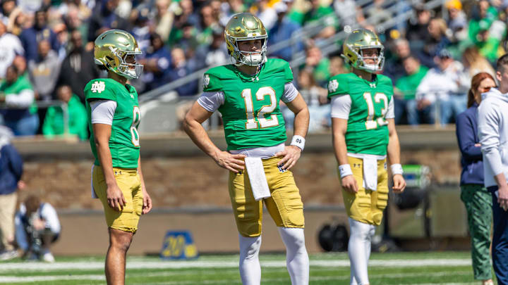 Apr 12, 2025; Notre Dame, IN, USA; Notre Dame Fighting Irish quarterback Kenny Minchey (8), Notre Dame Fighting Irish quarterback Blake Hebert (12), Notre Dame Fighting Irish quarterback CJ Carr (13) watch during the Blue-Gold game at Notre Dame Stadium. Mandatory Credit: Michael Caterina-Imagn Images