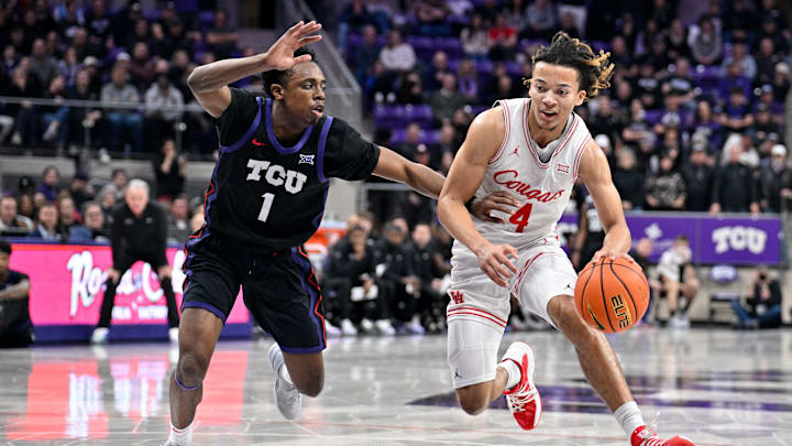 Jan 28, 2026; Fort Worth, Texas, USA; Houston Cougars guard Kingston Flemings (4) drives to the basket past TCU Horned Frogs guard Jayden Pierre (1) during the second half at Ed and Rae Schollmaier Arena. Mandatory Credit: Jerome Miron-Imagn Images