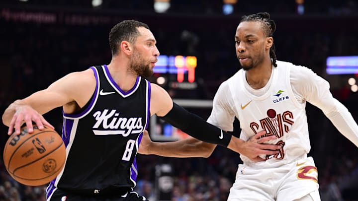 Apr 6, 2025; Cleveland, Ohio, USA; Sacramento Kings guard Zach LaVine (8) drives to the basket against Cleveland Cavaliers guard Darius Garland (10) during the first half at Rocket Arena.