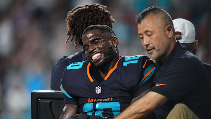Sep 29, 2025; Miami Gardens, Florida, USA; Miami Dolphins wide receiver Tyreek Hill (10) is tended to by medical staff after injuring his leg against the New York Jets during the second half at Hard Rock Stadium. Mandatory Credit: Rich Storry-Imagn Images