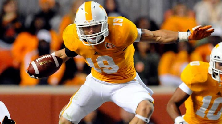 Tennessee running back Devrin Young (19) leaps over MTSU's Marquise Branton (34) during the first half against Saturday, Nov. 5, 2011 in Neyland Stadium.

Ut Devrin Young Leaping 2011