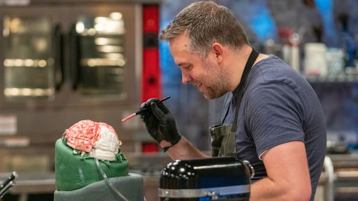Peter Tidwell paints his brain as seen on Halloween Baking Championship Season 5 Episode 6. photo provided by Food Network