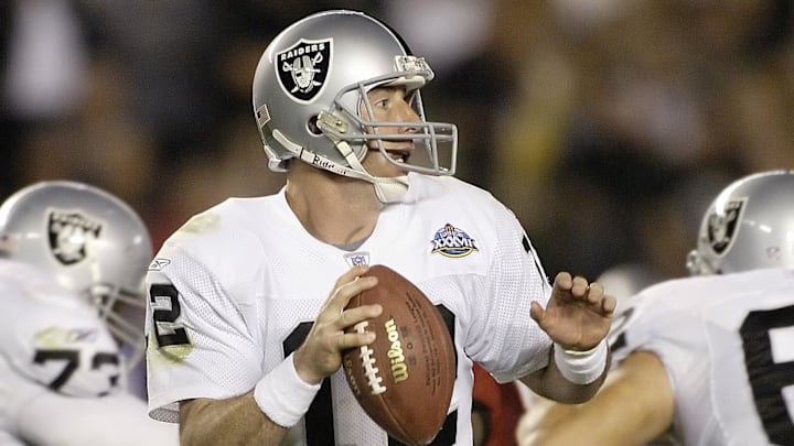 Jan 26, 2003; San Diego, CA, USA; FILE PHOTO; Oakland Raiders quarterback Rich Gannon (12) in action against the Tampa Bay Buccaneers during Super Bowl XXXVII at Qualcomm Stadium. The Bucs defeated the Raiders 48-21. Mandatory Credit: MPS-Imagn Images