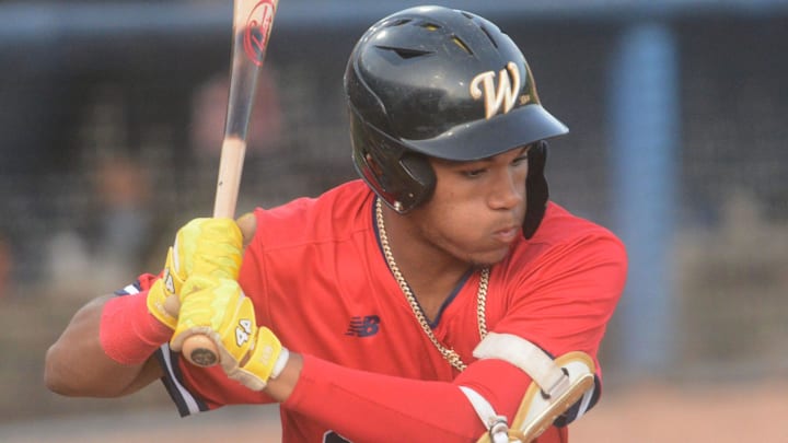 Brockton Rox's D'Angelo Ortiz, son of Red Sox great David Ortiz, looks at a Sea Unicorn pitch during a game at Dodd Stadium in Norwich, Conn.