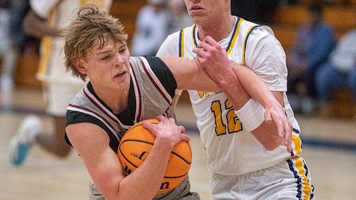 Santa Fe Catholic (2) Tate Darner fends off Winter Haven (12) Gavin Hall during first half basketball action Wednesday January 22, 2025 in Winter Haven Fl.
Ernst Peters/The Ledger