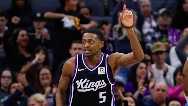 Jan 16, 2025; Sacramento, California, USA; Sacramento Kings guard De'Aaron Fox (5) points his finger in the air after a play against the Houston Rockets during the third quarter at Golden 1 Center. 