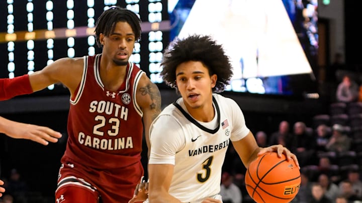 Jan 15, 2025; Nashville, Tennessee, USA;  Vanderbilt Commodores guard Tyler Tanner (3) dribbles past South Carolina Gamecocks guard Cam Scott (23) during the second half at Memorial Gymnasium. Mandatory Credit: Steve Roberts-Imagn Images