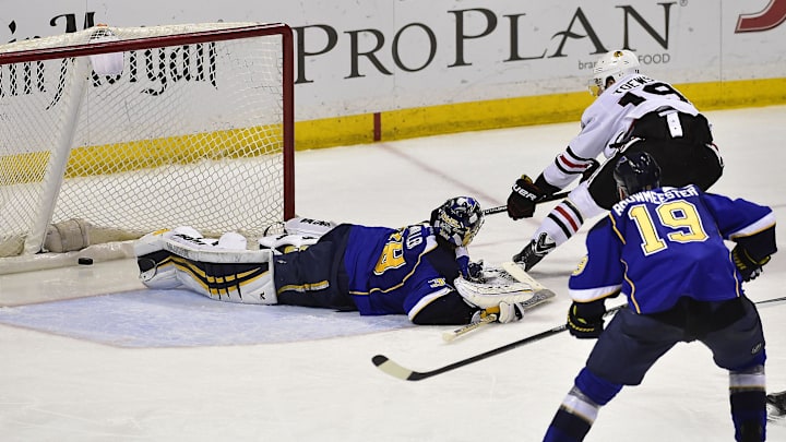 Apr 25, 2014; St. Louis, MO, USA; Chicago Blackhawks center Jonathan Toews (19) shoots and scores the game winning goal against St. Louis Blues goalie Ryan Miller (39) during overtime in game five of the first round of the 2014 Stanley Cup Playoffs at Scottrade Center. The Blackhawks defeated the Blues 3-2. Mandatory Credit: Scott Rovak-Imagn Images