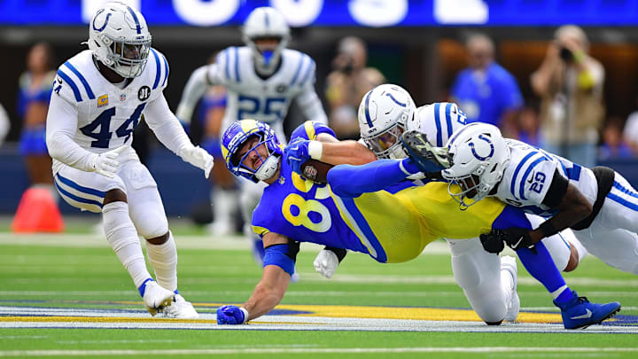 Sep 28, 2025; Inglewood, California, USA; Los Angeles Rams tight end Tyler Higbee (89) is brought down by Indianapolis Colts cornerback Mekhi Blackmon (29) and linebacker Chad Muma (55) during the first half at SoFi Stadium. Mandatory Credit: Gary A. Vasquez-Imagn Images Sep 28, 2025; Inglewood, California, USA; Los Angeles Rams tight end Tyler Higbee (89) is brought down by Indianapolis Colts cornerback Mekhi Blackmon (29) and linebacker Chad Muma (55) during the first half at SoFi Stadium. Mandatory Credit: Gary A. Vasquez-Imagn Images