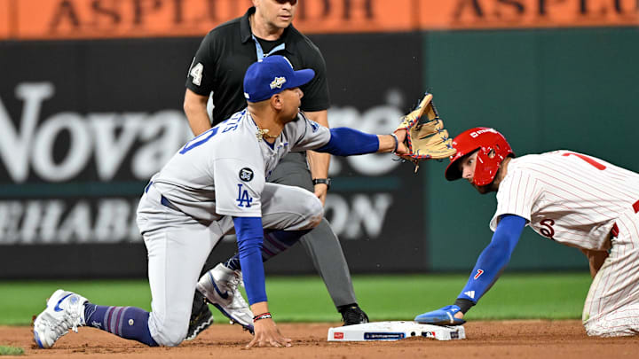 Oct 6, 2025; Philadelphia, Pennsylvania, USA; Philadelphia Phillies shortstop Trea Turner (7) is safe at second base as Los Angeles Dodgers shortstop Mookie Betts (50) is unable to hold onto the ball in the sixth inning during game two of the NLDS round for the 2025 MLB playoffs at Citizens Bank Park. Mandatory Credit: Eric Hartline-Imagn Images