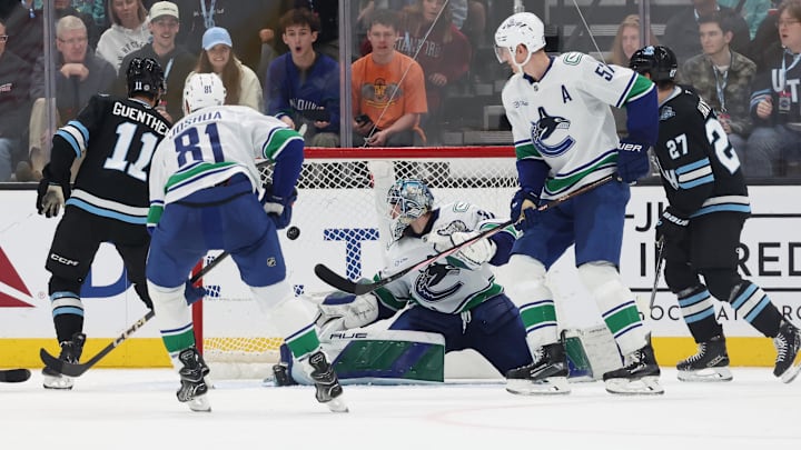 Feb 23, 2025; Salt Lake City, Utah, USA; Utah Hockey Club right wing Dylan Guenther (11) scores a goal against Vancouver Canucks goaltender Arturs Silovs (31) during the third period at Delta Center. Mandatory Credit: Rob Gray-Imagn Images
