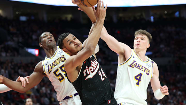 Apr 13, 2025; Portland, Oregon, USA: Portland Trail Blazers forward Kris Murray (24) fights for a rebound against Los Angeles Lakers center Trey Jemison III (55) and Lakers’ guard Dalton Knecht (4) in the first half at Moda Center. Mandatory Credit: Jaime Valdez-Imagn Images Apr 13, 2025; Portland, Oregon, USA: Portland Trail Blazers forward Kris Murray (24) fights for a rebound against Los Angeles Lakers center Trey Jemison III (55) and Lakers’ guard Dalton Knecht (4) in the first half at Moda Center. Mandatory Credit: Jaime Valdez-Imagn Images