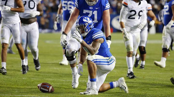 Oct 30, 2021; Provo, Utah, USA; Brigham Young Cougars running back Tyler Allgeier (25) reacts after running for a first down in third quarter against the Virginia Cavaliers at LaVell Edwards Stadium. Mandatory Credit: Jeffrey Swinger-Imagn Images