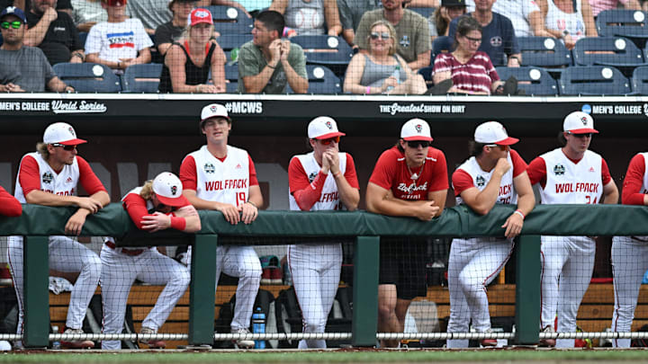 Jun 17, 2024; Omaha, NE, USA;  The NC State Wolfpack bench watches action against the Florida Gators during the ninth inning at Charles Schwab Field Omaha. Mandatory Credit: Steven Branscombe-Imagn Images