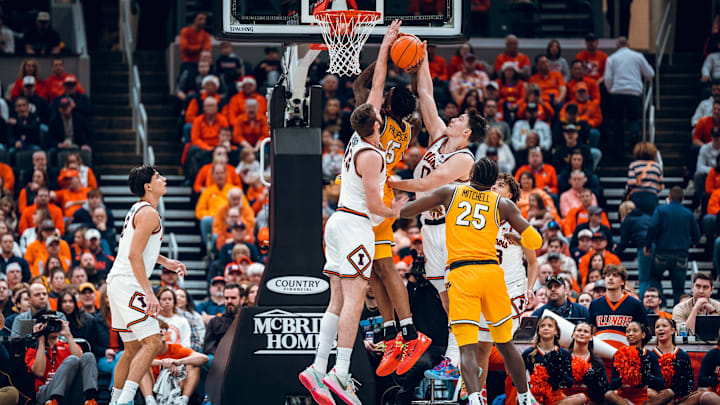 Illinois center Tomislav Ivisic and forward David Mirkovic reject Missouri center Shawn Phillips Jr. at the rim in the Illini's 91-48 win Monday at the Enterprise Center in St. Louis.