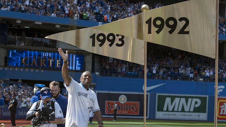 Aug 11, 2018; Toronto, Ontario, CAN; Former Toronto Blue Jays Joe Carter acknowledges the crowd during a pre game ceremony to honor Back to Back World Series wins in 1992 and 1993 before a game against the Tampa Bay Rays at Rogers Centre. Mandatory Credit: Nick Turchiaro-Imagn Images