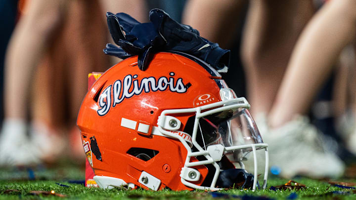 Dec 31, 2024; Orlando, FL, USA; A Illinois Fighting Illini helmet sitting on confetti after the game against the South Carolina Gamecocks at Camping World Stadium. Mandatory Credit: Jeremy Reper-Imagn Images