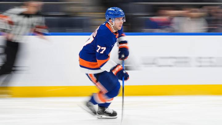 Apr 11, 2026; Elmont, New York, USA; New York Islanders defenseman Tony DeAngelo (77) carries the puck in the third period against the Ottawa Senators at UBS Arena. Mandatory Credit: Alexander Wohl-Imagn Images