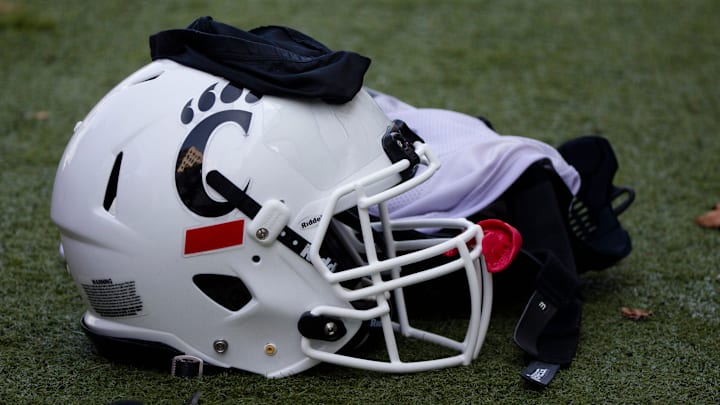 A Cincinnati Bearcats helmet and gloves sits on the turf during Cincinnati Bearcats football practice Wednesday, July 31, 2019, at the University of Cincinnati.
Cincinnati Bearcats 107 A Cincinnati Bearcats helmet and gloves sits on the turf during Cincinnati Bearcats football practice Wednesday, July 31, 2019, at the University of Cincinnati.
Cincinnati Bearcats 107