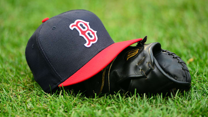 Oct 15, 2013; Detroit, MI, USA;  A Boston Red Sox hat and glove on the field prior to game three of the American League Championship Series baseball game against the Detroit Tigers at Comerica Park. Mandatory Credit: Andrew Weber-Imagn Images
