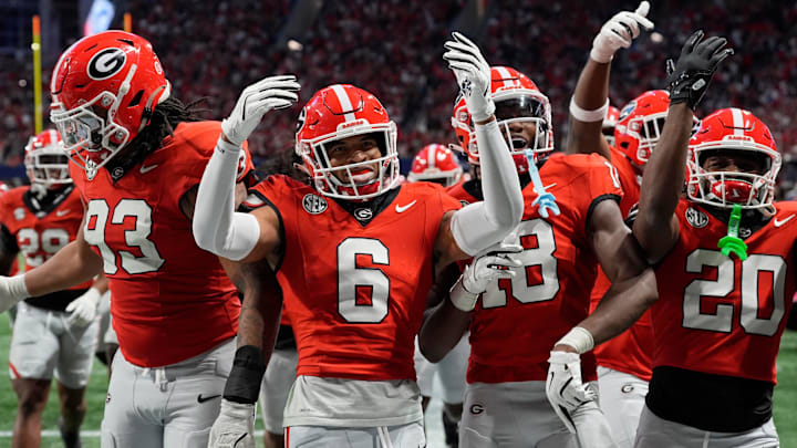 Georgia defensive back Daylen Everette (6) celebrates with his teammates after an interception against Texas during the second half of the 2024 SEC championship game at Mercedes-Benz Stadium in Atlanta.