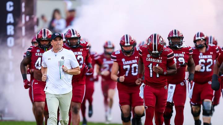 Nov 22, 2025; Columbia, South Carolina, USA; South Carolina Gamecocks head coach Shane Beamer leads his team onto the field before their game against the Coastal Carolina Chanticleers at Williams-Brice Stadium. Mandatory Credit: Jeff Blake-Imagn Images