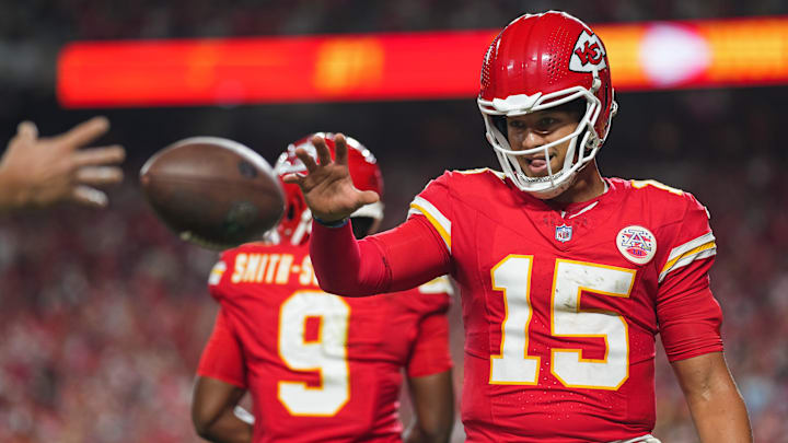 Sep 5, 2024; Kansas City, Missouri, USA; Kansas City Chiefs starting quarterback Patrick Mahomes (15) retrieves a touchdown ball belonging to wide receiver Xavier Worthy (not pictured) during the second half against the Baltimore Ravens at GEHA Field at Arrowhead Stadium. Mandatory Credit: Jay Biggerstaff-Imagn Images Sep 5, 2024; Kansas City, Missouri, USA; Kansas City Chiefs starting quarterback Patrick Mahomes (15) retrieves a touchdown ball belonging to wide receiver Xavier Worthy (not pictured) during the second half against the Baltimore Ravens at GEHA Field at Arrowhead Stadium. Mandatory Credit: Jay Biggerstaff-Imagn Images