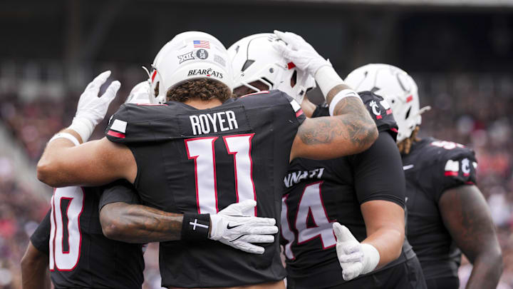 Sep 13, 2025; Cincinnati, Ohio, USA;  Cincinnati Bearcats tight end Joe Royer (11) celebrates with teammates after scoring a touchdown against the Northwestern State Demons in the first half at Nippert Stadium. Mandatory Credit: Aaron Doster-Imagn Images