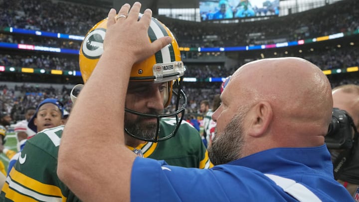 Oct 9, 2022; London, United Kingdom; Quarterback Aaron Rodgers (12) talks with New York Giants head coach Brian Daboll after an NFL International Series game at Tottenham Hotspur Stadium.  