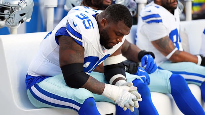 Dallas Cowboys defensive tackle Kenny Clark reacts on the bench in the second half against the Denver Broncos at Mile High.