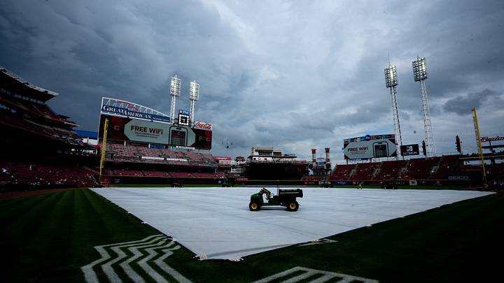 The tarp covers the field at Great American Ball Park in anticipation of rain before the Cincinnati Reds and Pittsburgh Pirates game on Saturday, Aug. 1, 2026.