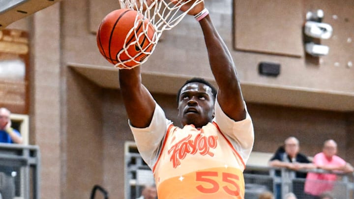 Team Faygo and Michigan State's Coen Carr dunks against Team Case Credit Union in the game on Thursday, June 27, 2024, during the Moneyball Pro-Am at Holt High School.