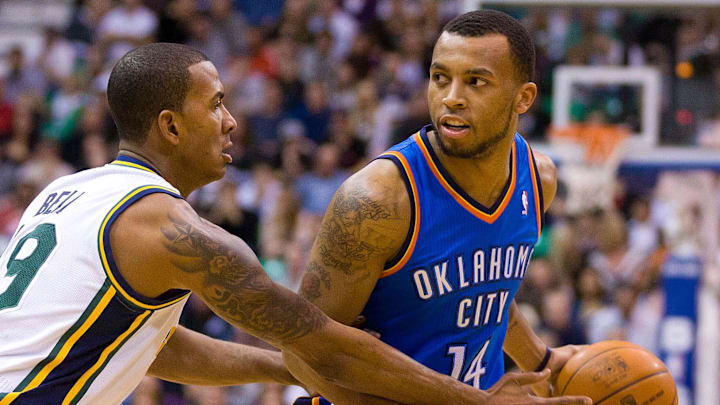February 10, 2012; Salt Lake City, UT, USA; Oklahoma City Thunder shooting guard Daequan Cook (14) is defended by Utah Jazz shooting guard Raja Bell (19) during the first half at EnergySolutions Arena. February 10, 2012; Salt Lake City, UT, USA; Oklahoma City Thunder shooting guard Daequan Cook (14) is defended by Utah Jazz shooting guard Raja Bell (19) during the first half at EnergySolutions Arena.