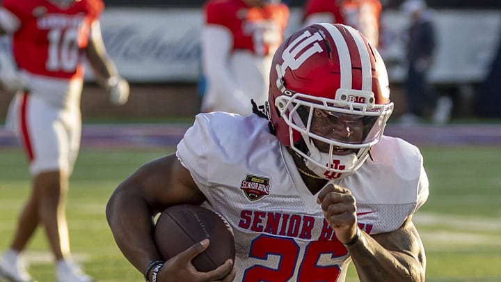 Jan 29, 2026; Mobile, AL, USA; American running back Kaelon Black (26) of Indiana runs the ball during American Senior Bowl practice at Hancock Whitney Stadium. Mandatory Credit: Vasha Hunt-Imagn Images