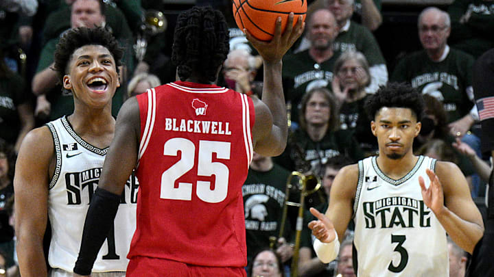  Mar 2, 2025; East Lansing, Michigan, USA;  Michigan State Spartans guard Jeremy Fears Jr. (1) and teammate guard Jaden Akins (3) celebrate as the clock winds down on Wisconsin Badgers guard John Blackwell (25) at Jack Breslin Student Events Center. Mandatory Credit: Dale Young-Imagn Images