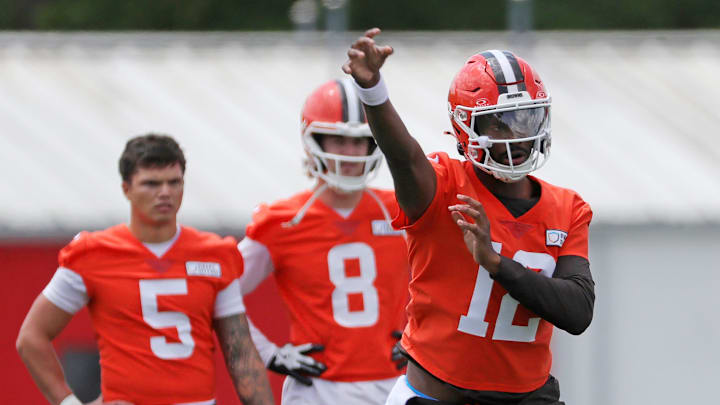 Browns quarterback Shedeur Sanders throws as QBs Dillon Gabriel (5) and Kenny Pickett look on during minicamp, Tuesday, June 10, 2025, in Berea.