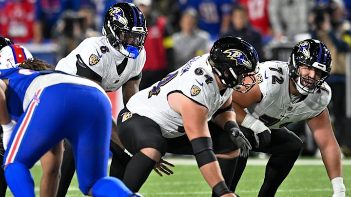 Sep 7, 2025; Orchard Park, New York, USA; Baltimore Ravens quarterback Lamar Jackson (8) with center Tyler Linderbaum (64) and guard Andrew Vorhees (72) at the line of scrimmage in the first quarter against the Buffalo Bills at Highmark Stadium. Mandatory Credit: Mark Konezny-Imagn Images