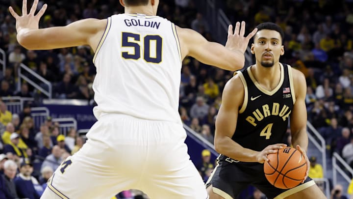Purdue forward Trey Kaufman-Renn (4) is defended by Michigan center Vladislav Goldin (50) 