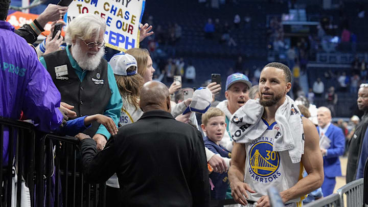 Mar 3, 2025; Charlotte, North Carolina, USA;  Golden State Warriors guard Stephen Curry (30) reacts to his home town fans as he makes his way to the locker rooom after the second half against the Charlotte Hornets at Spectrum Center. Mandatory Credit: Jim Dedmon-Imagn Images
