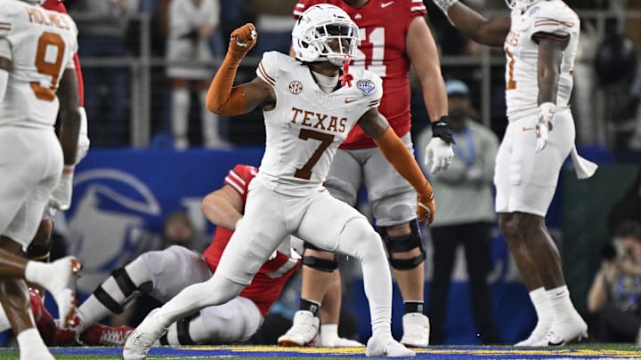 Jan 10, 2025; Arlington, Texas, USA; Texas Longhorns defensive back Jahdae Barron (7) celebrates after a sack during the second quarter of the College Football Playoff semifinal against the Ohio State Buckeyes in the Cotton Bowl at AT&T Stadium. Mandatory Credit: Jerome Miron-Imagn Images