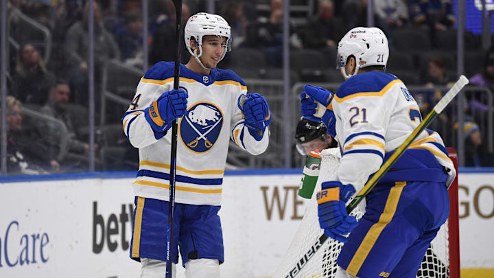 Feb 25, 2022; St. Louis, Missouri, USA; Buffalo Sabres center Dylan Cozens (24) is congradulated by right wing Kyle Okposo (21) after scoring a goal against the St. Louis Blues during the first period at Enterprise Center. Mandatory Credit: Jeff Le-Imagn Images