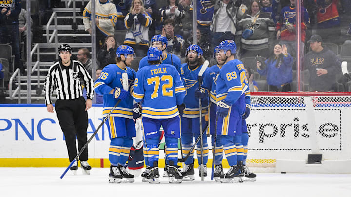 Jan 11, 2025; St. Louis, Missouri, USA;  St. Louis Blues defenseman Colton Parayko (55) is congratulated by teammates after scoring against the Columbus Blue Jackets during the third period at Enterprise Center. Mandatory Credit: Jeff Curry-Imagn Images