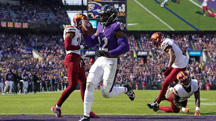 Baltimore Ravens running back Derrick Henry rushes for a second quarter touchdown against the Washington Commanders.