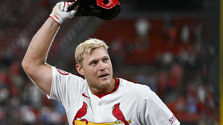 Aug 21, 2024; St. Louis, Missouri, USA;  St. Louis Cardinals pinch hitter Luken Baker (26) salutes the fans as he receives a curtain call after hitting a two run home run against the Milwaukee Brewers during the seventh inning at Busch Stadium. Mandatory Credit: Jeff Curry-Imagn Images