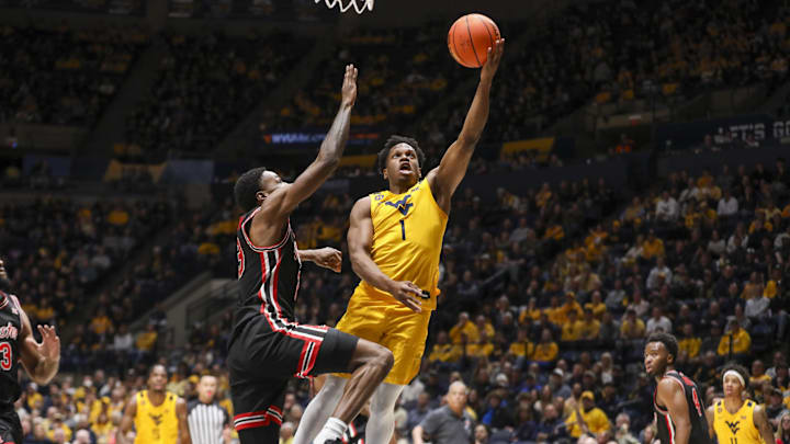 Jan 29, 2025; Morgantown, West Virginia, USA; West Virginia Mountaineers guard Joseph Yesufu (1) shoots against Houston Cougars guard Terrance Arceneaux (23) during the first half at WVU Coliseum. Mandatory Credit: Ben Queen-Imagn Images Jan 29, 2025; Morgantown, West Virginia, USA; West Virginia Mountaineers guard Joseph Yesufu (1) shoots against Houston Cougars guard Terrance Arceneaux (23) during the first half at WVU Coliseum. Mandatory Credit: Ben Queen-Imagn Images