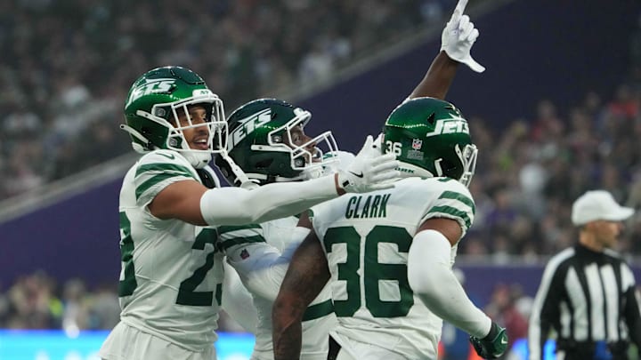 Oct 6, 2024; London, United Kingdom; New York Jets safety Tony Adams (22), cornerback Isaiah Oliver (23) and safety Chuck Clark (36) celebrate against the Minnesota Vikings  in the second half at Tottenham Hotspur Stadium.