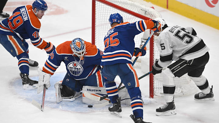 Apr 14, 2025; Edmonton, Alberta, CAN; Edmonton Oilers goalie Calvin Pickard (30) looks for the puck with defenseman DArnell Nurse (25) against Los Angeles Kings right wing Quinton Byfield (5) during the second period at Rogers Place. Mandatory Credit: Walter Tychnowicz-Imagn Images