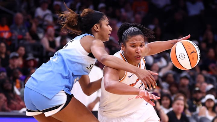 Aug 28, 2025; Phoenix, Arizona, USA; Phoenix Mercury forward Alyssa Thomas (25) drives to the basket against Chicago Sky forward Angel Reese (5) in the second half at Phx Arena. Mandatory Credit: Mark J. Rebilas-Imagn Images