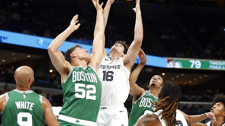 Oct 8, 2025; Memphis, Tennessee, USA: Memphis Grizzlies center PJ Hall (16) collects a rebound over Boston Celtics center Luka Garza (52) during the third quarter at FedExForum. Mandatory Credit: Petre Thomas-Imagn Images Oct 8, 2025; Memphis, Tennessee, USA: Memphis Grizzlies center PJ Hall (16) collects a rebound over Boston Celtics center Luka Garza (52) during the third quarter at FedExForum. Mandatory Credit: Petre Thomas-Imagn Images