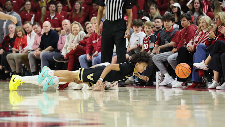 Jan 20, 2026; Fayetteville, Arkansas, USA; Vanderbilt Commodores guard Tyler Tanner (3) dives for a loose ball during the second half against the Arkansas Razorbacks at Bud Walton Arena. Arkansas won 93-68. Mandatory Credit: Nelson Chenault-Imagn Images